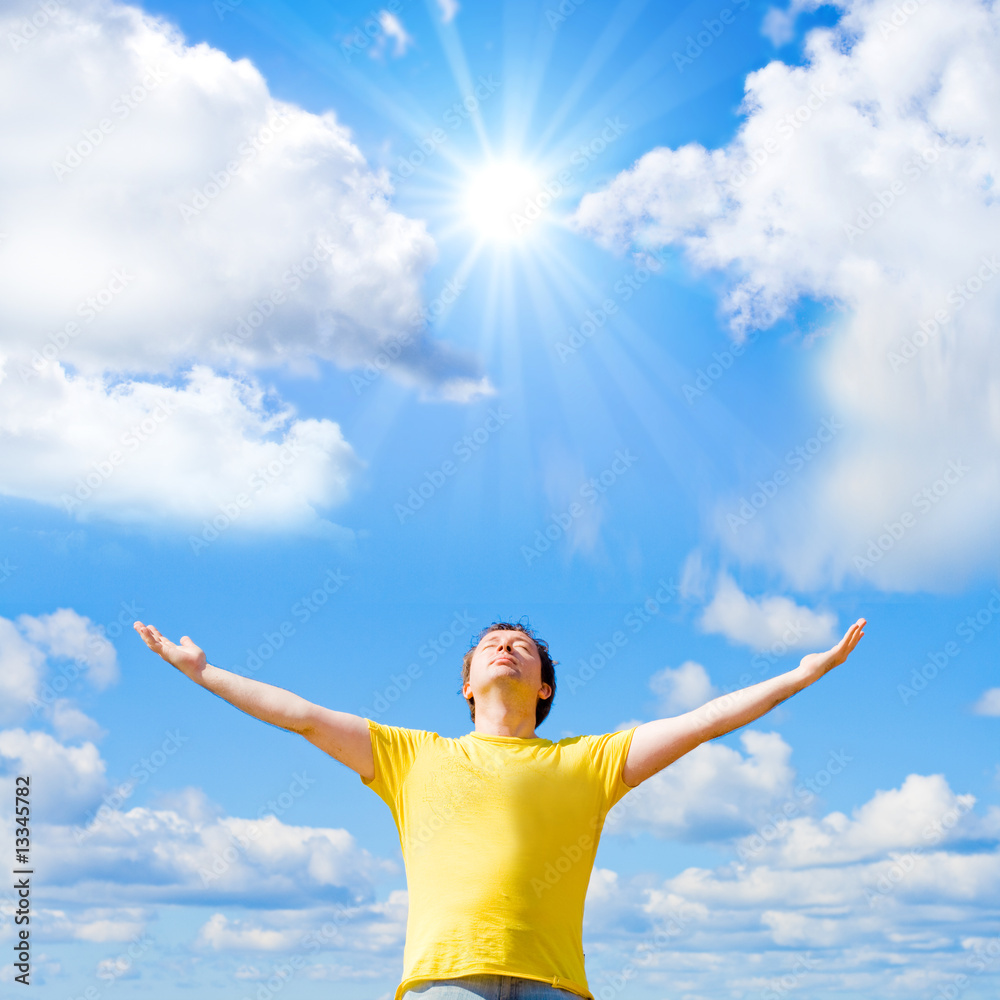 Man spreading his arms to the sun Man spreading his arms to the sun