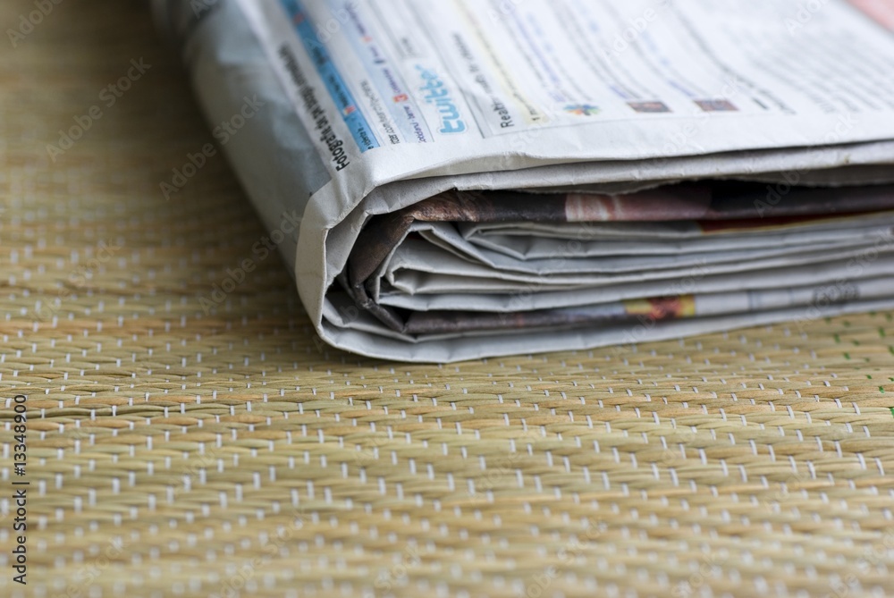 close up newspapers in morning on wood background close up newspapers in morning on wood background