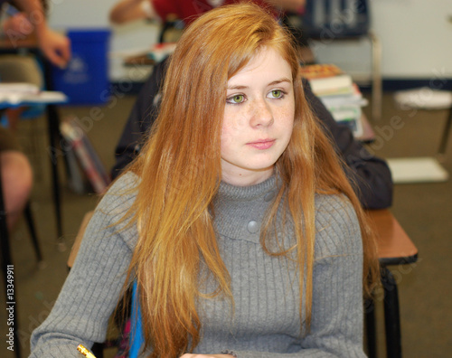 Strawberry blonde taking notes
