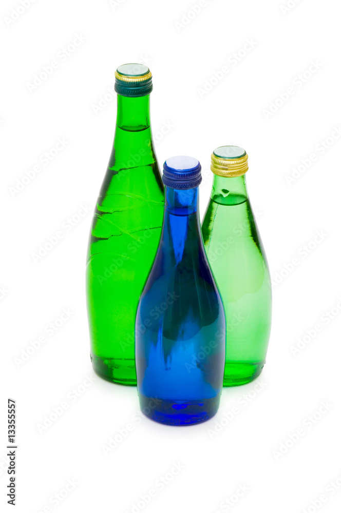 Bottles of water isolated on the white Bottles of water isolated on the white
