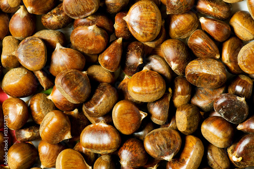 Many chestnuts arranged at the background photo