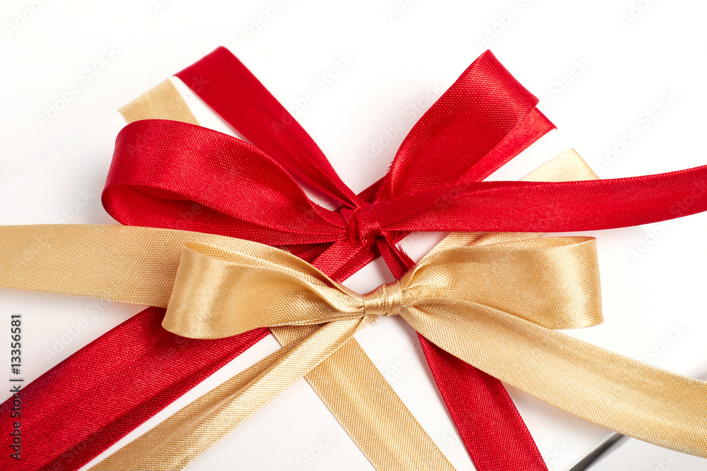 Fototapeta premium Big red, gold bow on white background