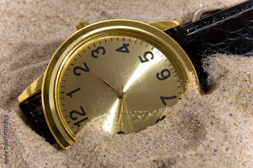 Clock on sand bacground