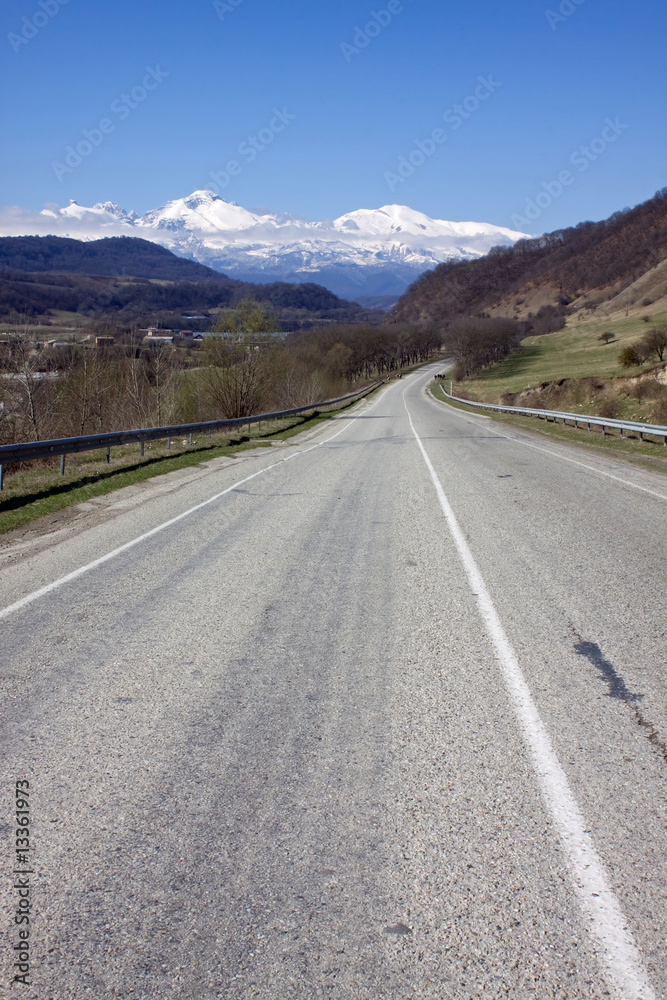 Naklejka premium A road is in the mountains of Caucasus