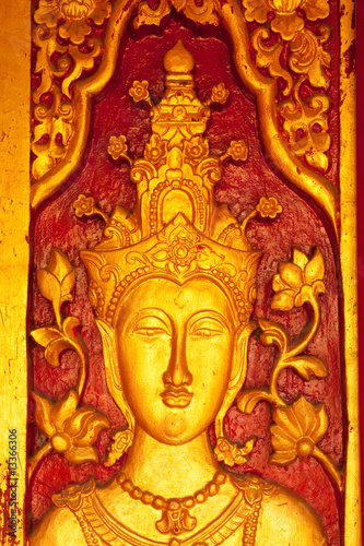 Traditional Thai style Buddhist church door wood carving