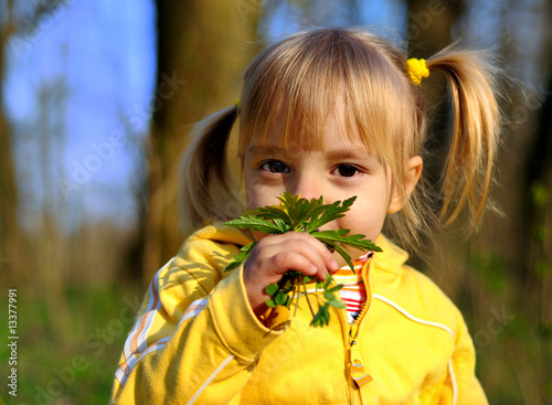 Little girl and wild flowers