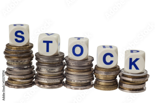 Stacks of coins with the word stock isolated on white