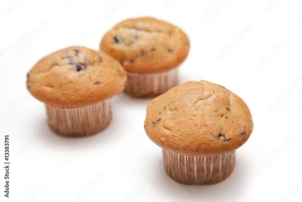Muffins isolated on a white studio background. Muffins isolated on a white studio background.