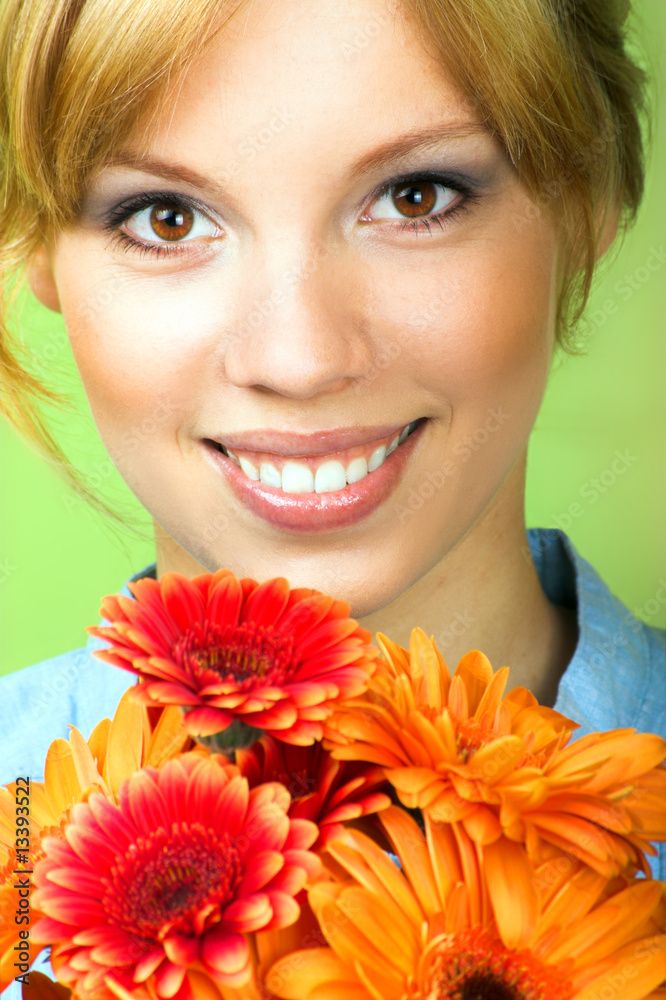 Beauty portrait of a young woman with a flower Beauty portrait of a young woman with a flower