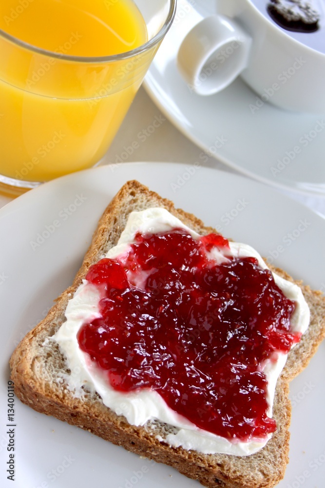 Breakfast with toast, jam and orange juice Breakfast with toast, jam and orange juice