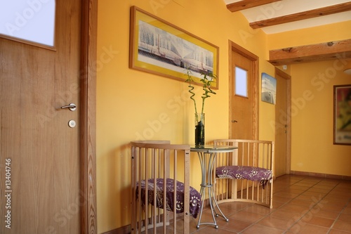 Lobbit, corridor in yellow wooden beams, spanish photo