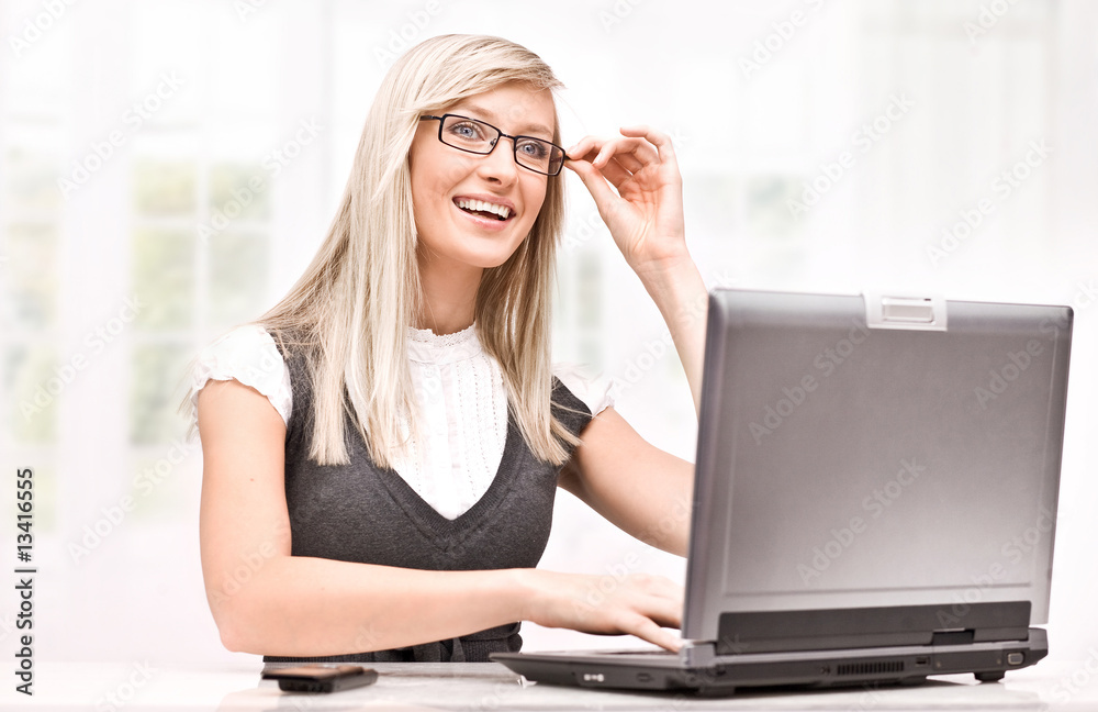 Young happy woman using notebook Young happy woman using notebook