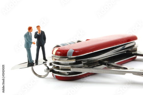 business people on penknife