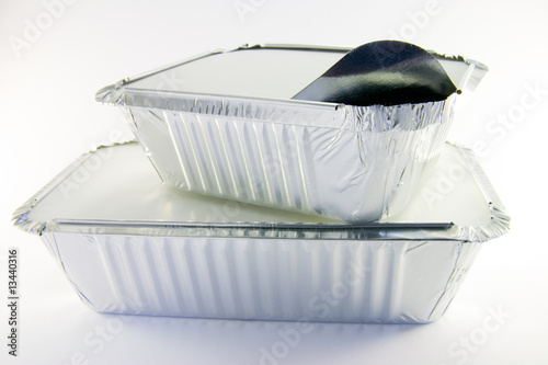 One rectangle and one square partly opened catering trays