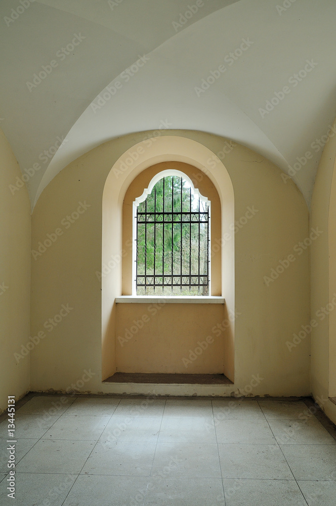 Catholic religious construction. Metal lattice at a window