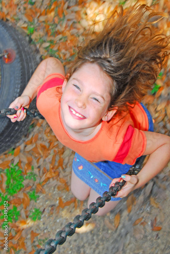 happy girl on swing photo