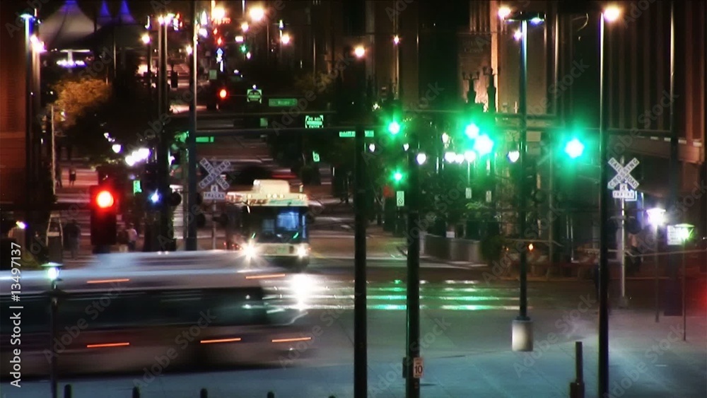 Downtown City Traffic at Night with Buses and Pedestrians (1025)