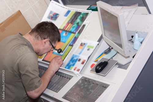 Printer checking a print run photo