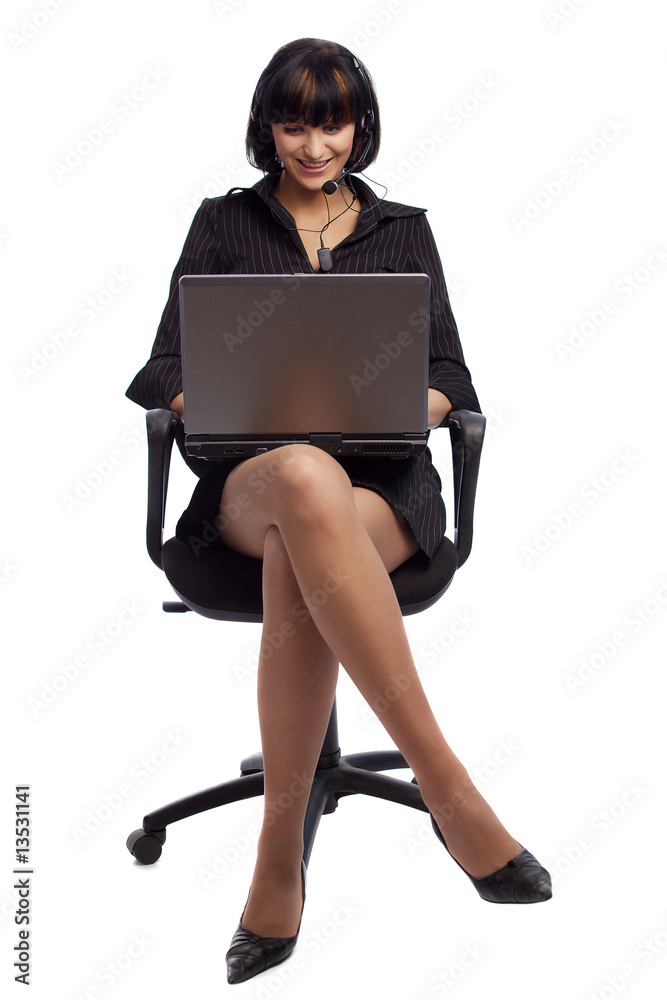 Pleasured brunette woman sitting in the chair, working on laptop Pleasured brunette woman sitting in the chair, working on laptop
