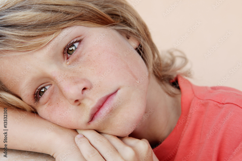 sad child crying with visible tears rolling down face sad child crying with visible tears rolling down face