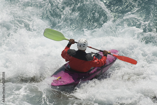 kayak on the wawes of the sea