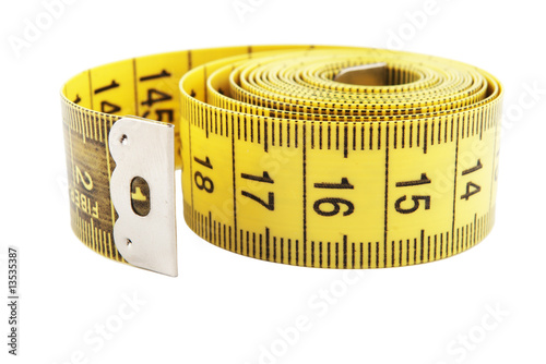 yellow measuring tape reel on white