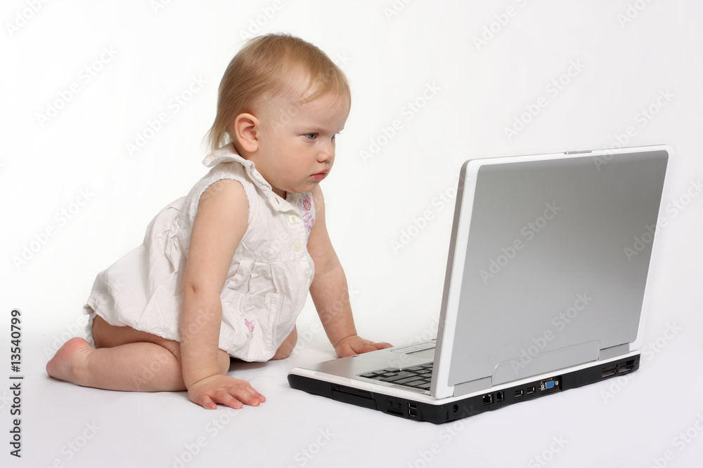 little girl looking on the laptop little girl looking on the laptop