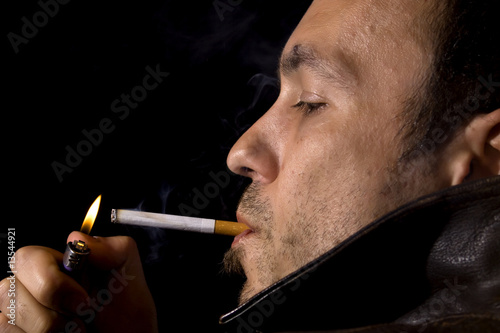Young man smoking a cigarette