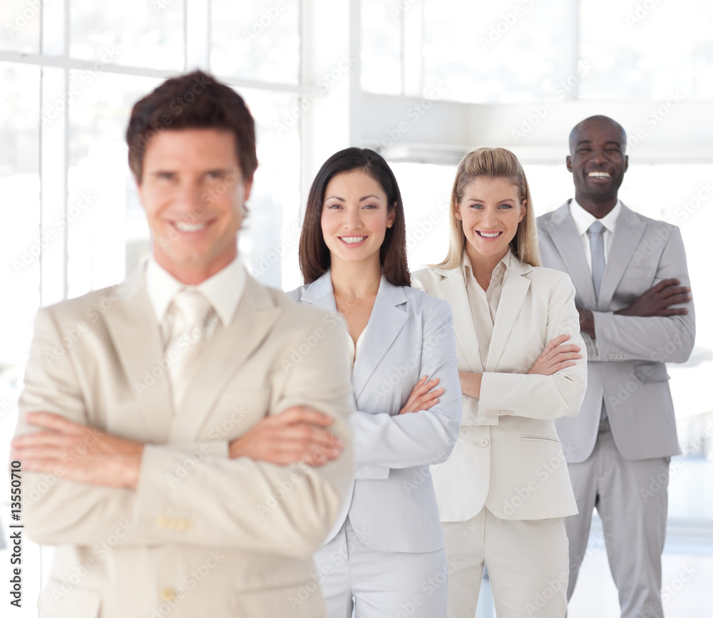 Business man with arms folded in front of Business Team Business man with arms folded in front of Business Team
