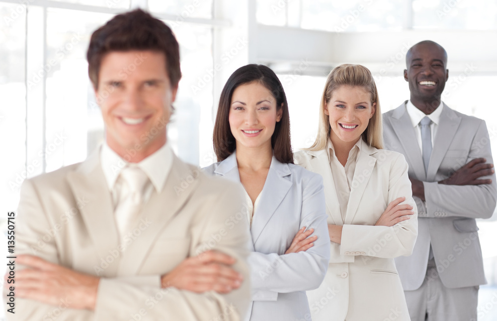 Business man with arms folded in front of Business Team Business man with arms folded in front of Business Team