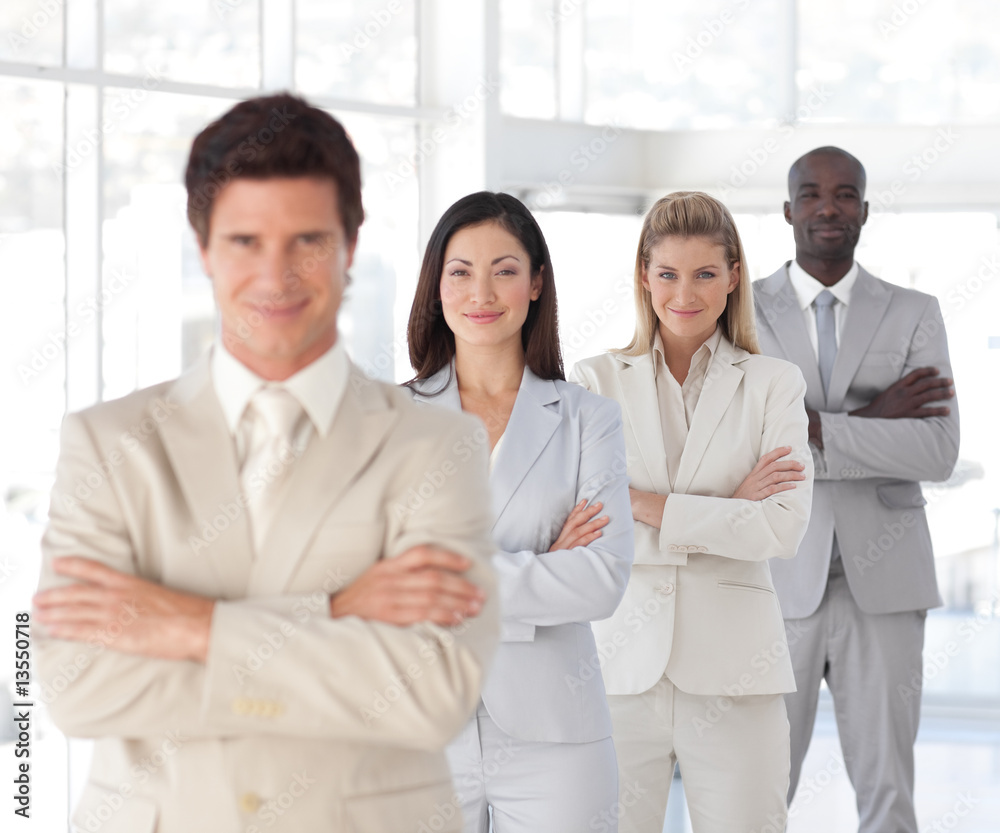 Business man with arms folded in front of Business Team Business man with arms folded in front of Business Team