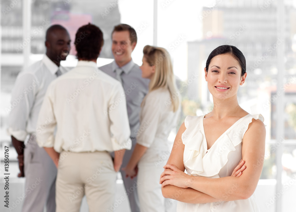 Attracive businesswoman in front of a group of associates Attracive businesswoman in front of a group of associates