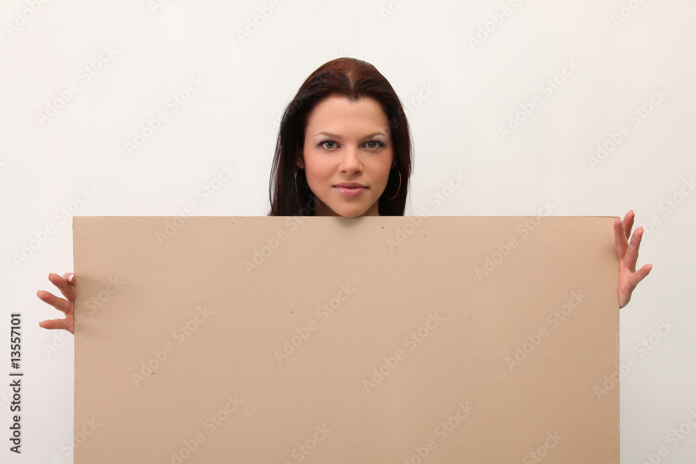 Female holding sign or board