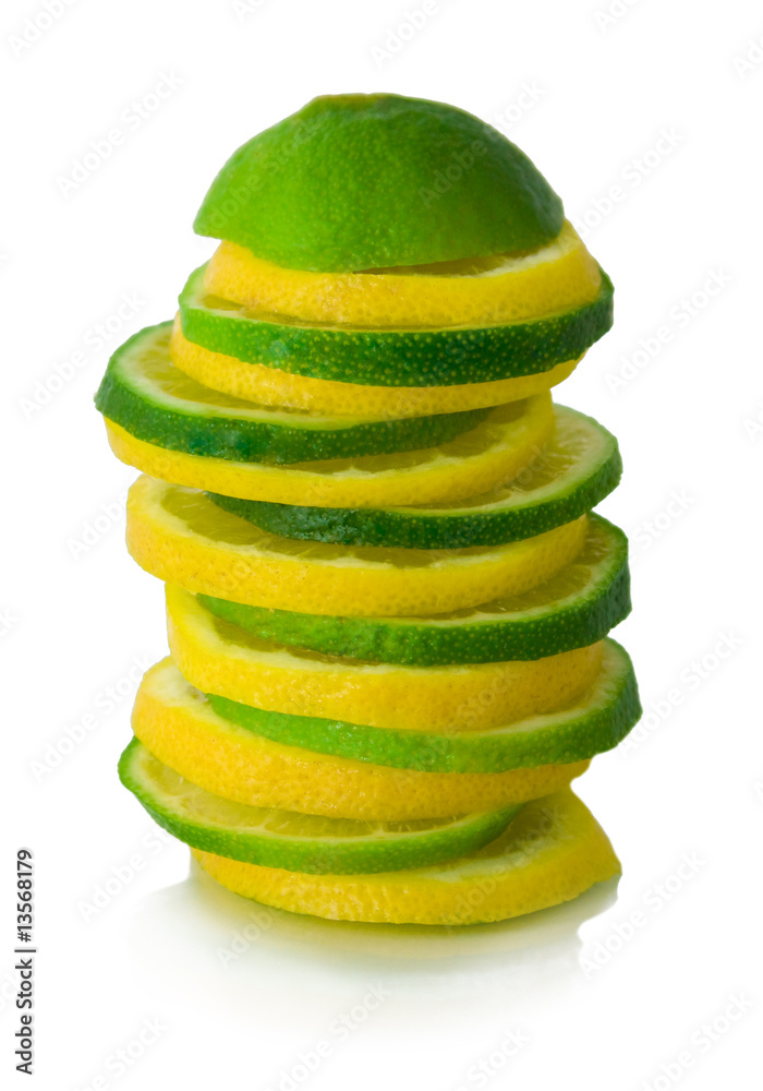 Sliced green and yellow limes shallow, isolated Sliced green and yellow limes shallow, isolated