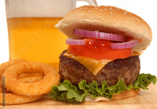 Cheeseburger with onion rings and beer
