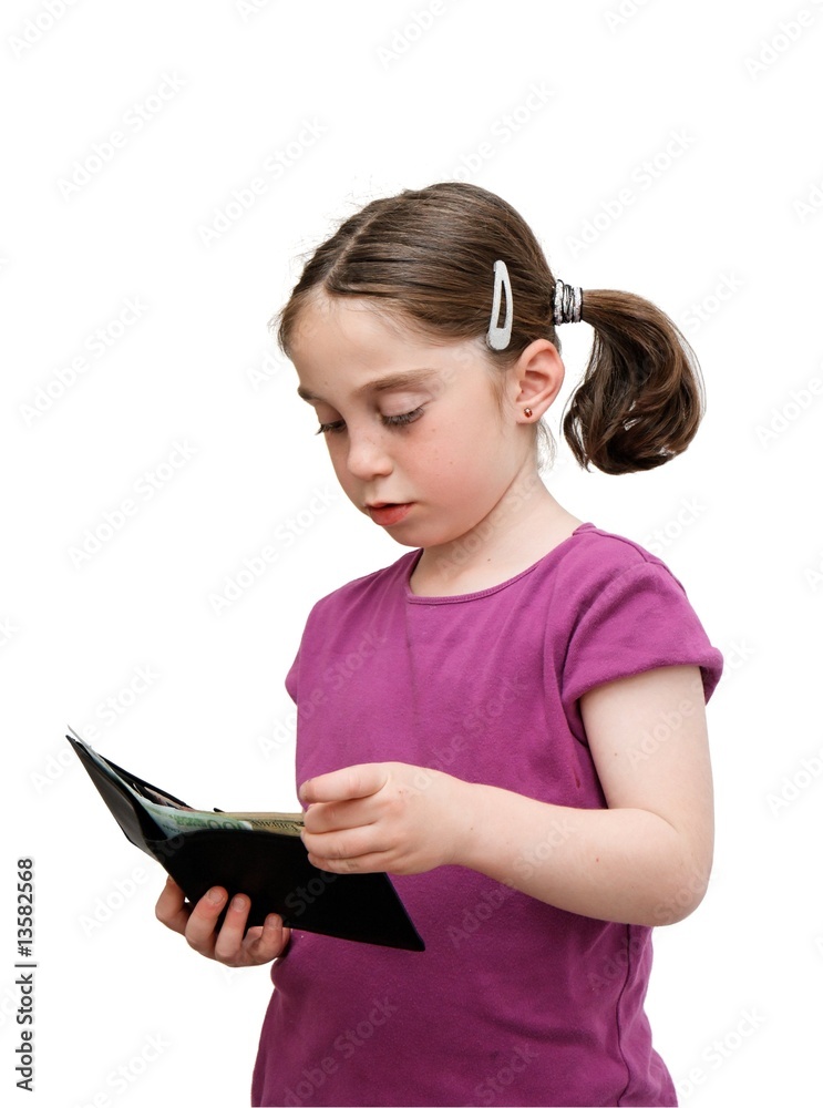 Serious seven years girl with pigtails holds a wallet with money Serious seven years girl with pigtails holds a wallet with money