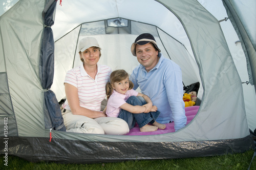 Happy family in tent