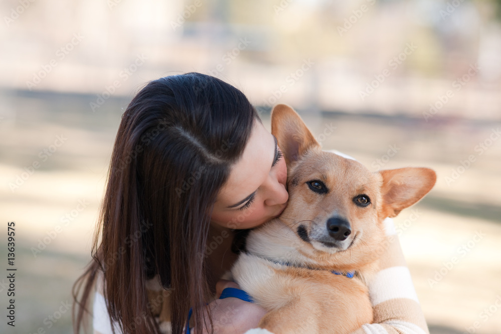 Beautiful young woman with a dog