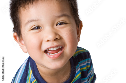 Happy Asian preschool-aged boy, close up