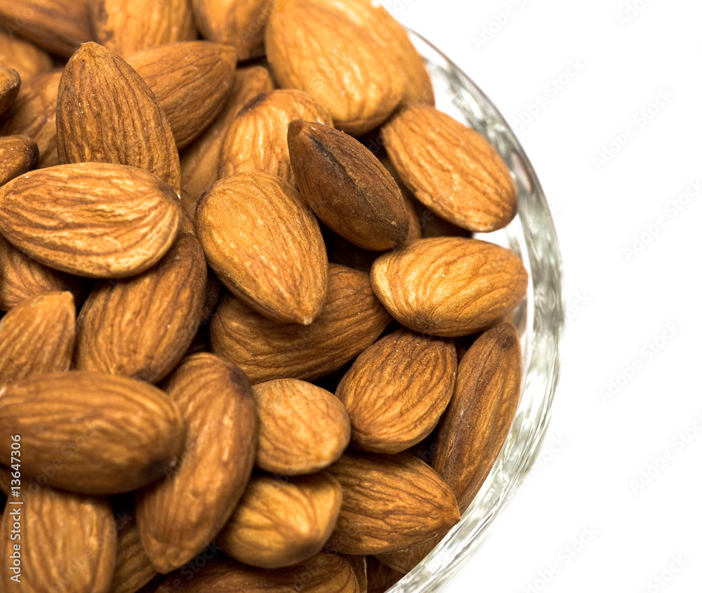 many almonds nuts in glass bowl many almonds nuts in glass bowl