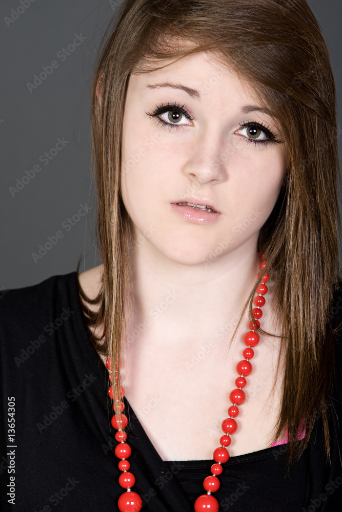 Shot of a Pretty Teenager with a Worried Look on her Face