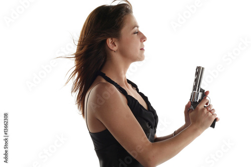 young woman with revolver isolated on white background