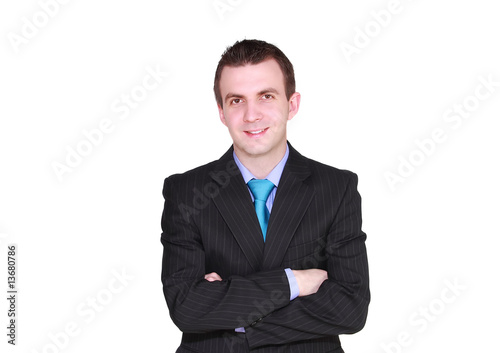 Cheerful young businessman with arms crossed, smiling.Isolated