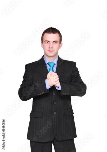 Cheerful young businessman with arms crossed .Isolated