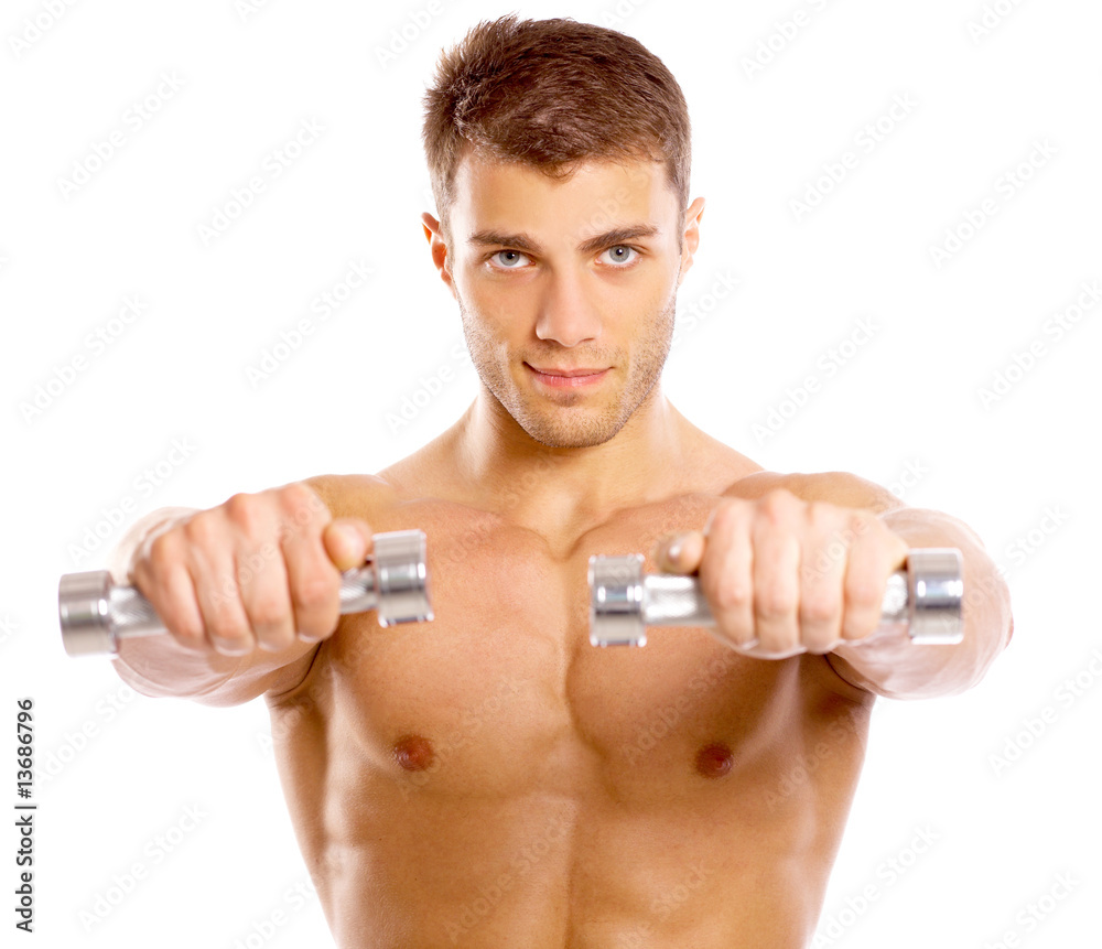 Muscular and tanned male during excersing with dumbbells Muscular and tanned male during excersing with dumbbells