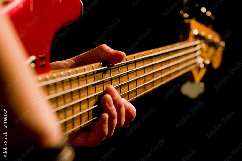 Closeup Photo Of Bass Guitar Player Stock Photo - Download Image