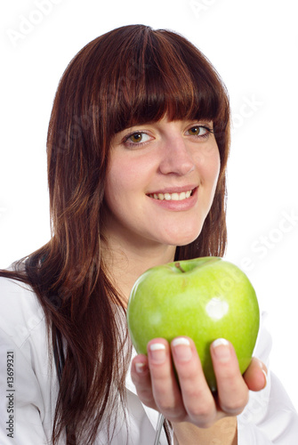 Pretty nurse with fresh green apple