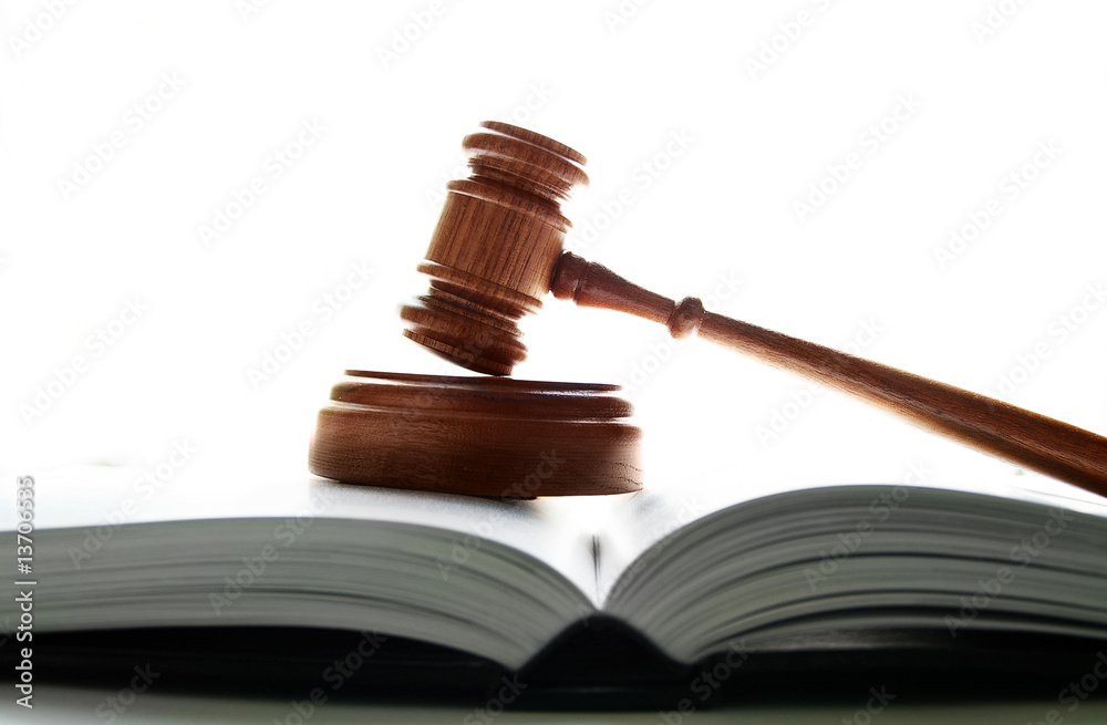 judges court gavel on a lawbook, on white background