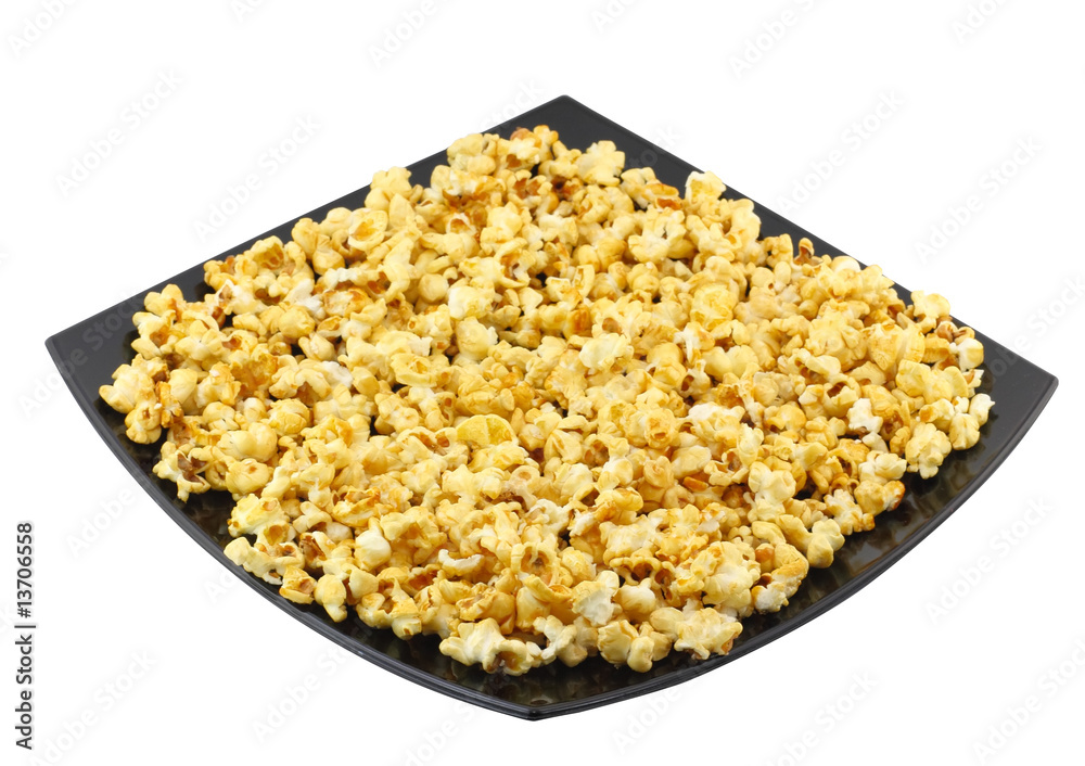 Fragment of plate with fresh caramel popcorn. Isolated Fragment of plate with fresh caramel popcorn. Isolated