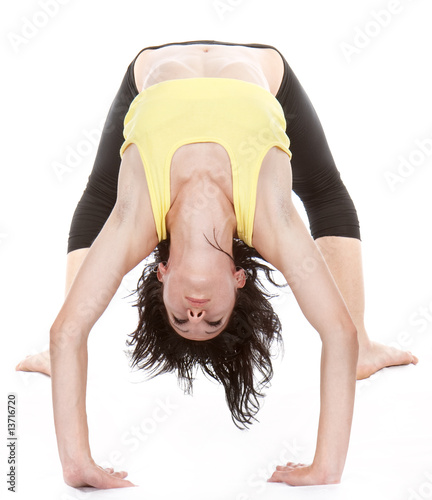 young yoga female doing yogatic exericise photo